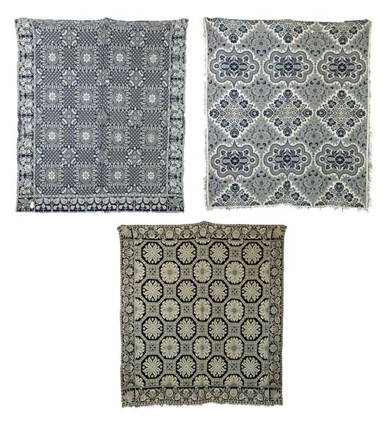 THREE JACQUARD COVERLETS.  American
