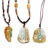 THREE JADE PENDANTS To include