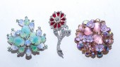 THREE KRAMER BROOCHES Comprisi