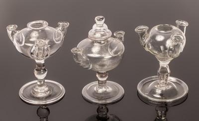 Three lacemaker's lamps, two with