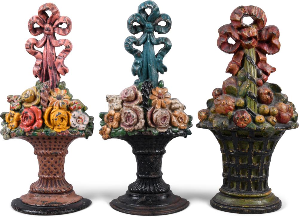 THREE LARGE CAST IRON DOORSTOPS