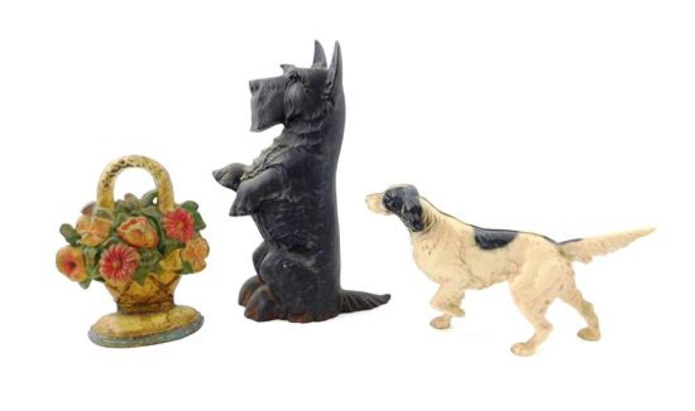 THREE LARGE CAST IRON DOORSTOPS