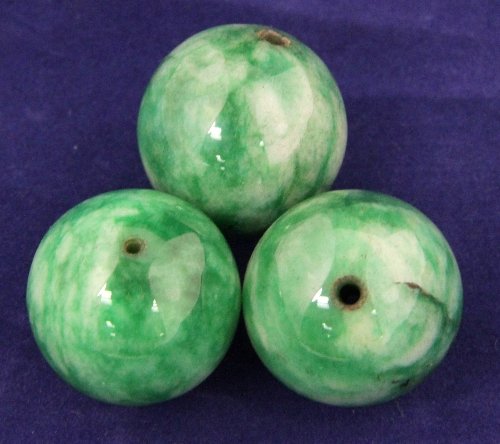 Three large jade beads