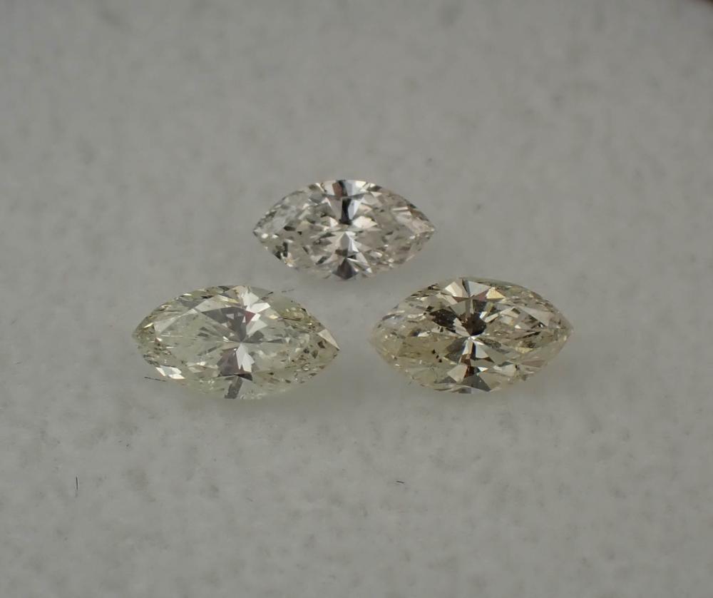 THREE LOOSE MARQUISE-CUT