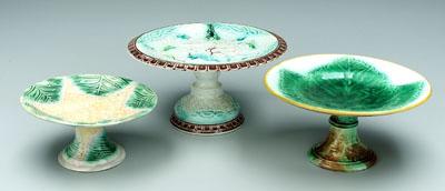Three majolica compotes: one with