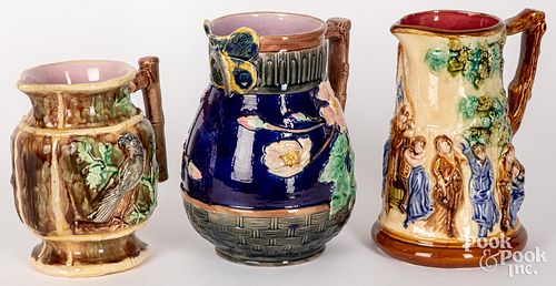 THREE MAJOLICA PITCHERS, LATE