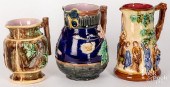 THREE MAJOLICA PITCHERS, LATE