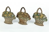 THREE MATCHING CAST-IRON BASKE