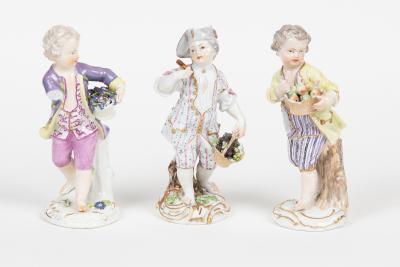 Three Meissen figures of boys, each