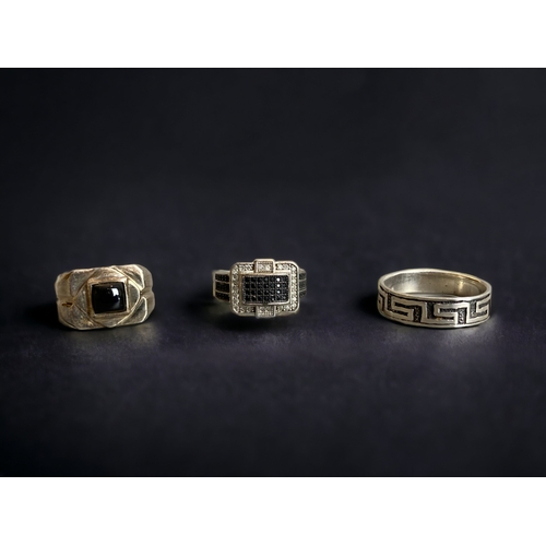 THREE MENS STERLING SILVER RINGS.
