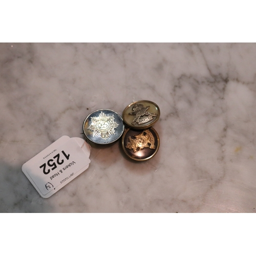 Three military related broches