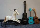 THREE MINI GUITARS AND A CAROU