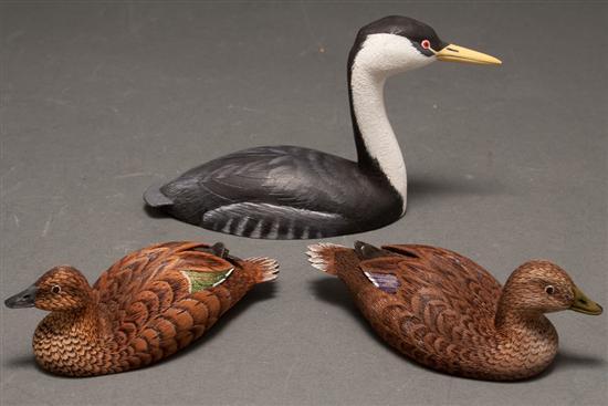 Three miniature carved and