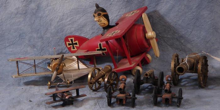 Three model biplanes, along with