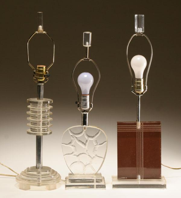 Three modern lucite lamps; one made