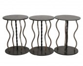 THREE MODERNIST IRON STOOLSman