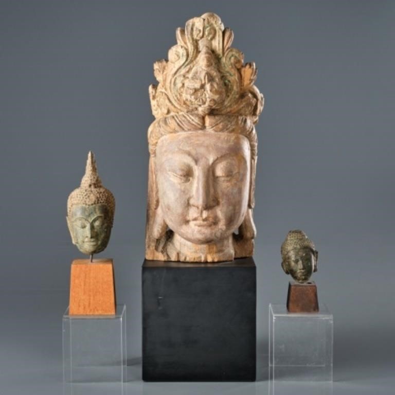 THREE MOUNTED HEADS OF EASTERN