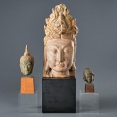 THREE MOUNTED HEADS OF EASTERN
