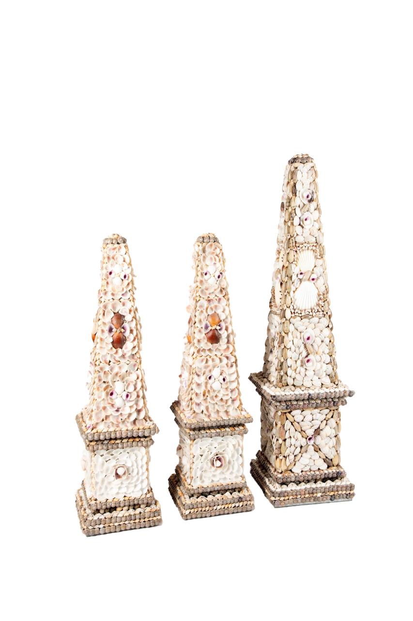 THREE NATURAL SHELL ENCRUSTED