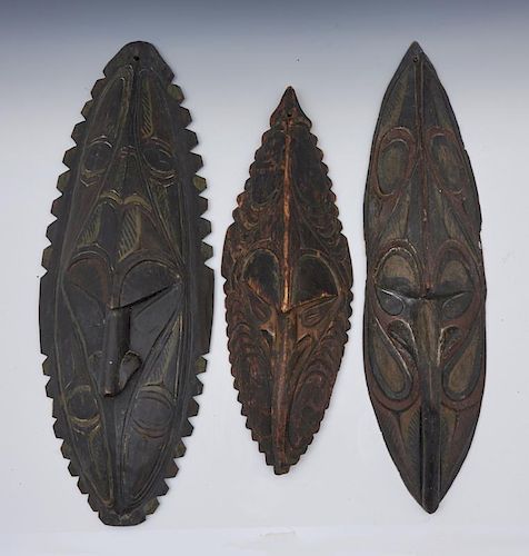 THREE NEW GUINEA WOODEN