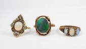 THREE OPAL AND YELLOW GOLD RIN