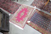 THREE ORIENTAL STYLE RUGS. A r