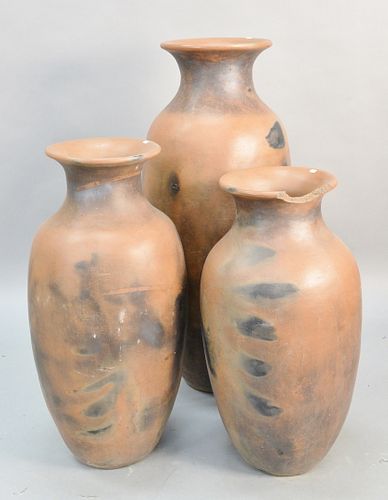 THREE OUTDOOR TERRACOTTA URNS,