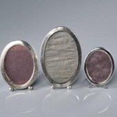THREE OVAL STERLING PHOTO FRAM