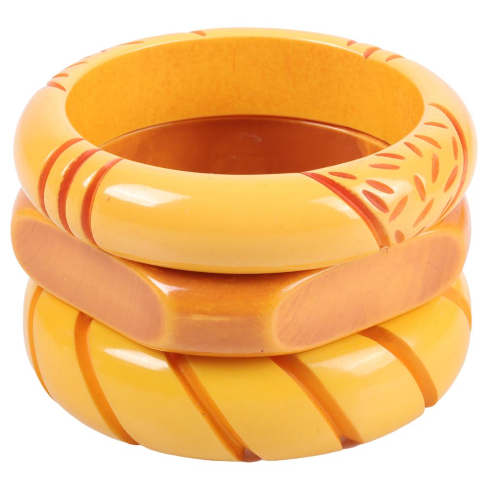 THREE OVERDYED CREAM BAKELITE