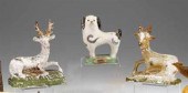 Three painted chalkware figure