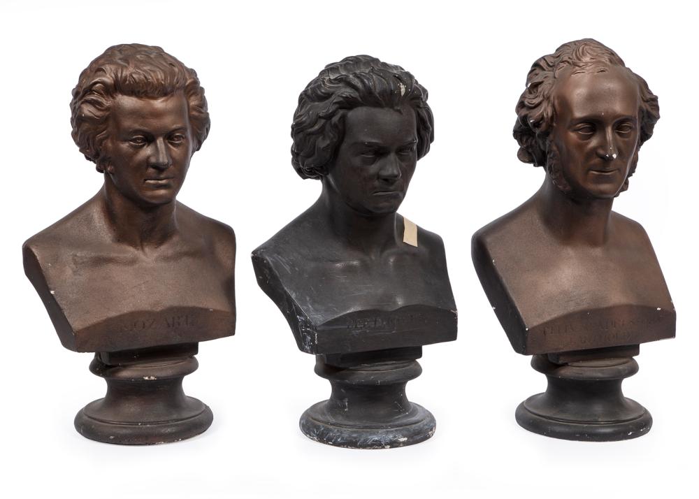 THREE PAINTED PLASTER BUSTS OF