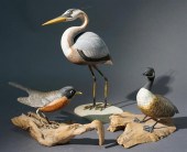 THREE PAINTED WOOD CARVINGS OF