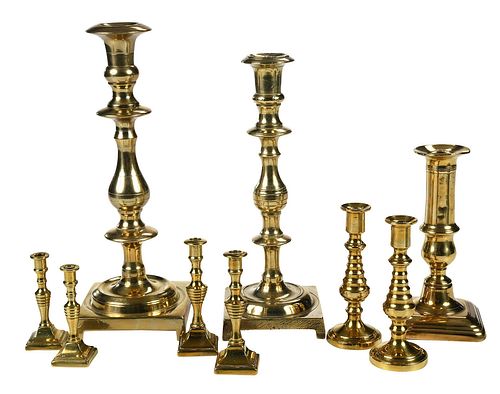 THREE PAIRS OF BRASS TAPER