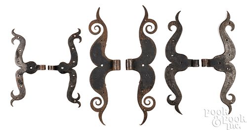 THREE PAIRS OF WROUGHT IRON RAM'S