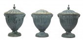 THREE PATINATED LEAD GARDEN UR