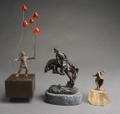 THREE PATINATED METAL FIGURINE