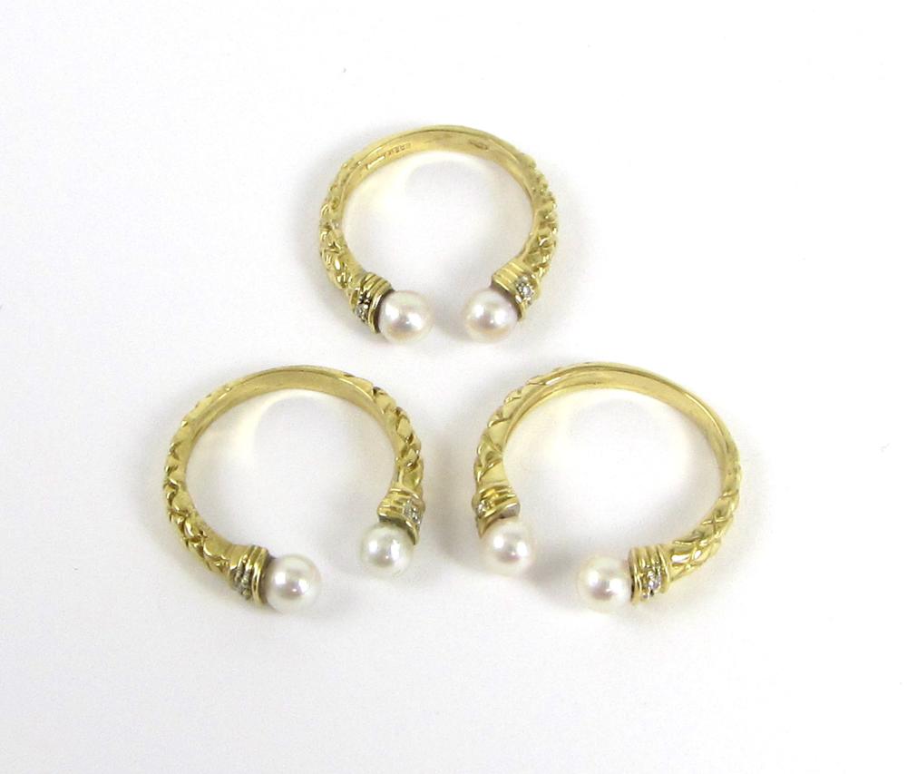 THREE PEARL AND EIGHTEEN KARAT GOLD