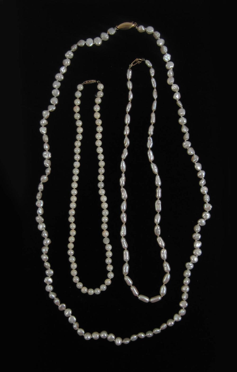 THREE PEARL AND FOURTEEN KARAT GOLD