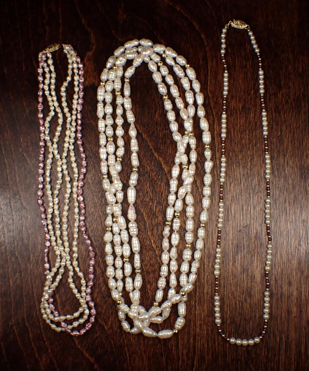 THREE PEARL AND FOURTEEN KARAT GOLD