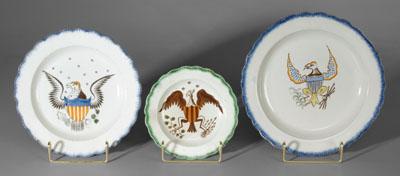 Three pearlware eagle plates: one