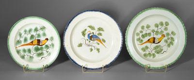 Three pearlware peafowl plates: one