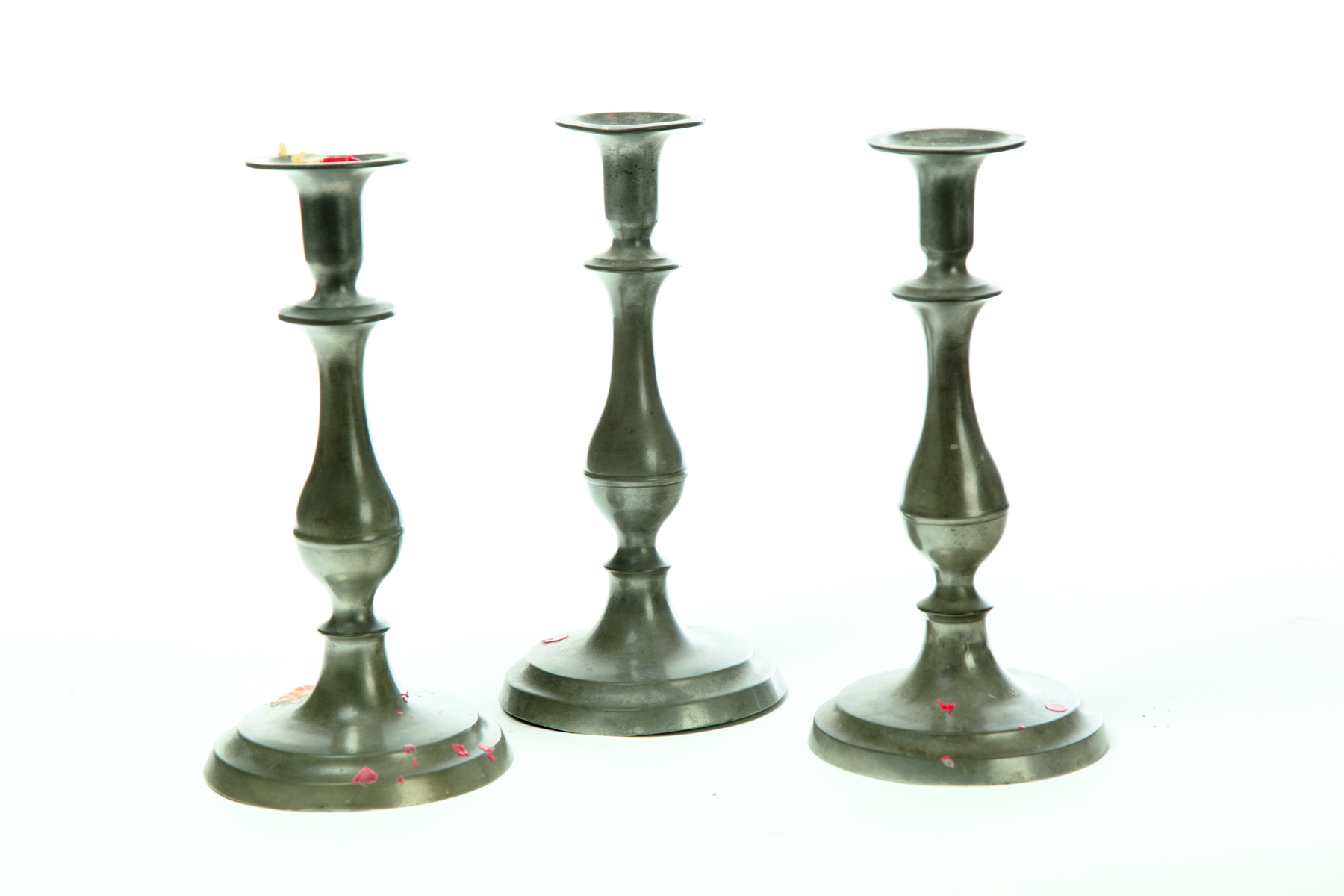THREE PEWTER CANDLESTICKS.  Flagg