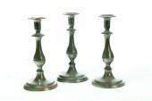 THREE PEWTER CANDLESTICKS.  Fl