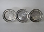 Three pewter plates with molde