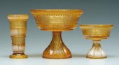 Three pieces holly amber glass