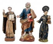 THREE POLYCHROMED WOOD SANTOS