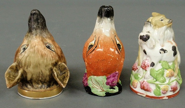Three porcelain fox head stirrup