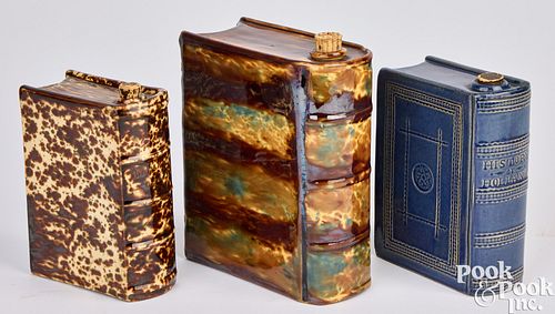 THREE POTTERY BOOK FLASKSThree