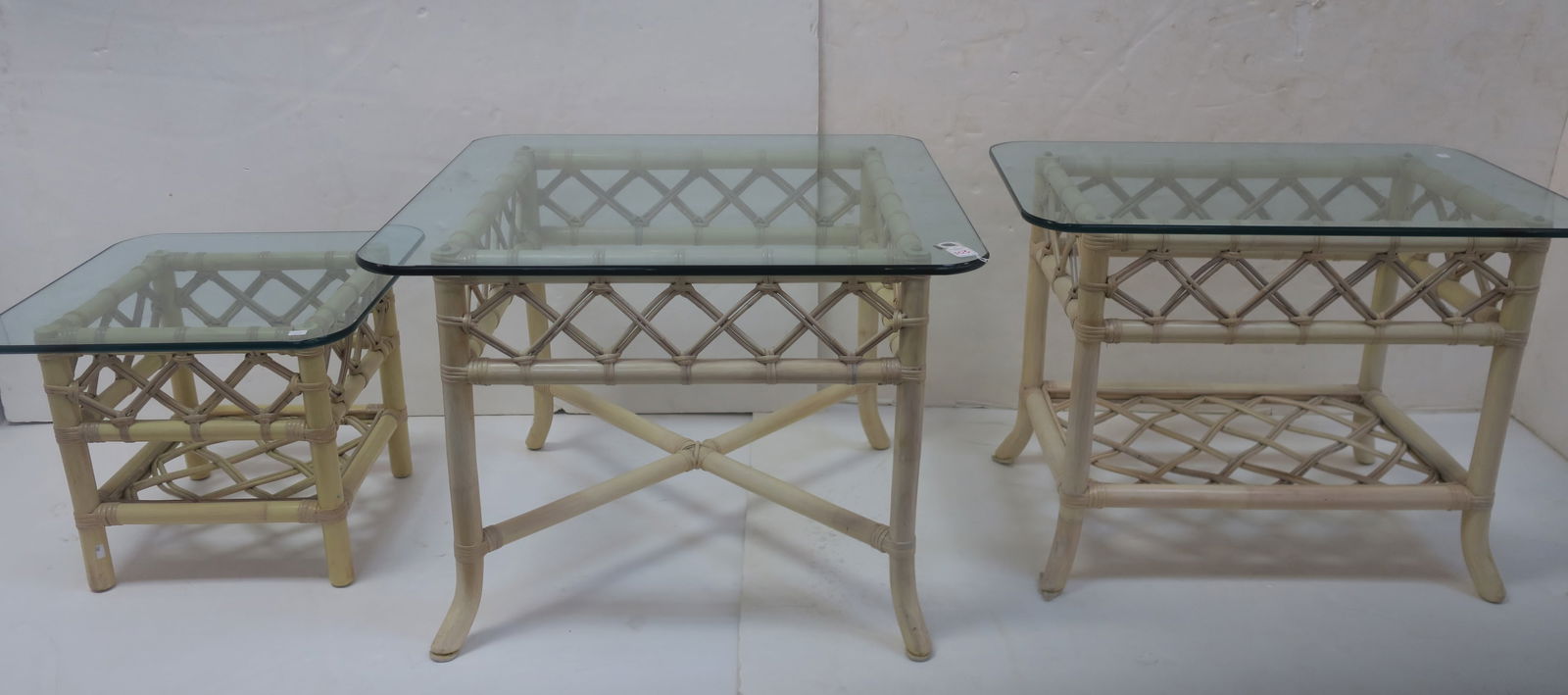 THREE RATTAN GLASS TOPPED
