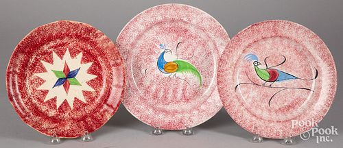 THREE RED SPATTER PLATES WITH